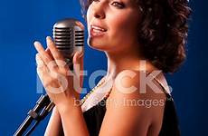 singing woman microphone into premium freeimages stock istock getty
