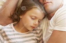 daughter sleeping father bed stock peaceful children