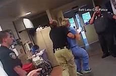 nurse handcuffed utah giving blood police patient