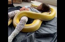 snake girl coiled pet little around her huge