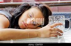 woman drunk alcoholism sleeping female table alamy stock drinking asleep terrace outdoors young after