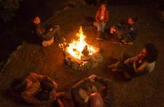 campfire stories ghost around telling scary short fire paranormal tell camping standing supernatural kids lovetoknow halloween myth community circle friends