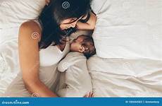 bed son mother sleeping together young boy baby women