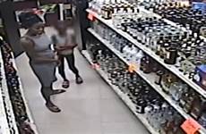 woman shoplift child shoplifting caught camera