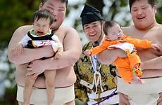 festival crying babies sumo japan student celebrates april referee clad wrestlers beside hold tokyo costume traditional