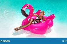 flaming tanned laughing inflatable swimming sitting pool amazing pink woman hair young body long sexy beautiful