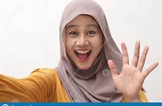 cheerful waving hijab gesture