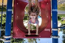 upside down girl playground playing alamy stock little equipment outdoor play