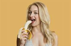 banana eating woman beautiful blond colored portrait background over person preview