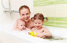 bath bathing baby mother together children family foam
