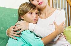 consoling woman son teenage sad calm preview