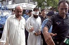 pakistani escorting police blasphemy case girl imam held cleric khalid muslim officers appear chishti pakistan yesterday islamabad court