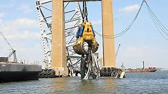 The HSWC500 1000 giant hydraulic claw goes to work clearing the wreckage of the Baltimore Bridge