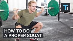 An exercise scientist demonstrates the proper squat