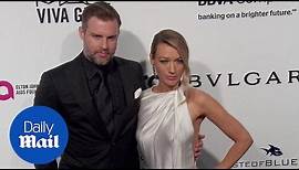 Natalie Zea and Travis Schuldt arrive at Elton John Oscar bash - Daily Mail