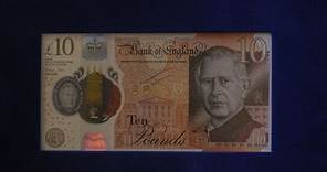 Carlos III reaparece en público junto a los primeros billetes con su rostro