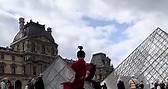 A Chinese female martial artist shows off her impressive Kung Fu skills outside the Louvre Museum in Paris