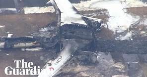 Aerials show plane wreckage after crash at Japan's Haneda airport