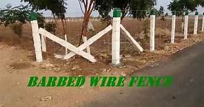 Barbed wire fence installation