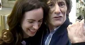 EXCLUSIVE - Rolling Stones' Ronnie Wood And Wife Sally Swarmed By Fans At LAX