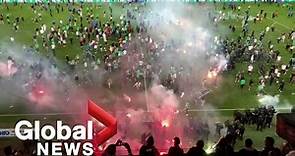 Saint-Etienne fans storm pitch, hurl flares after team relegated from Ligue 1