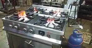 Cocina industrial de acero inoxidable de 4 hornillas con horno