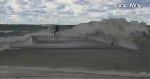 Surfers struggle with huge waves at Lake Huron