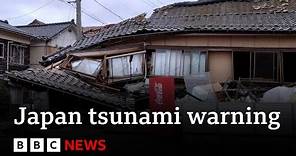 Japan downgrades major tsunami warning after earthquakes - BBC News