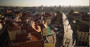 Aerial timelapse of Charles Bridge as viewed from the Malá Strana side, with pedestrians moving