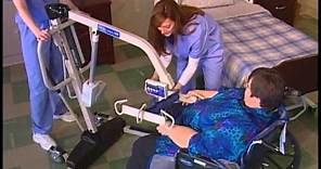 Transferring a patient from wheelchair to bed with a Reliant 600 and full body sling.