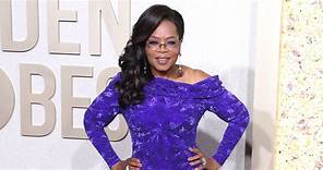 Oprah Winfrey looks incredible in a purple off-shoulder gown