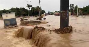Deadly flooding blocks roadway in Haiti's Leogane