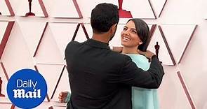 Riz Ahmed helps wife Fatima Farheen Mirza with her hair at the Oscars