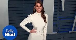 Camila Morrone walks the red carpet at Vanity Fair Oscar Party