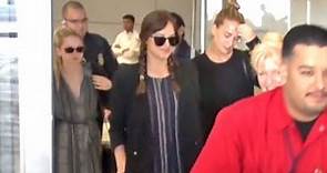 Dakota Johnson And Sisters Stella And Grace Arrive At LAX After Attending Gucci Cruise In Italy