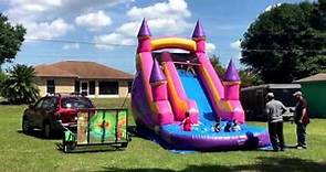 Bounce house trailer spray paint happy colors. Dry slide indoor basketball court.
