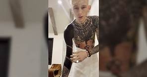Machine Gun Kelly shares bloody behind-the-scenes look at blackout tattoo process