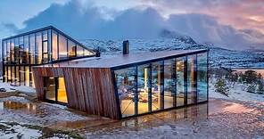 Glass house in Norway by Stinessen Architecture, with stunning views of the fjord and mountains
