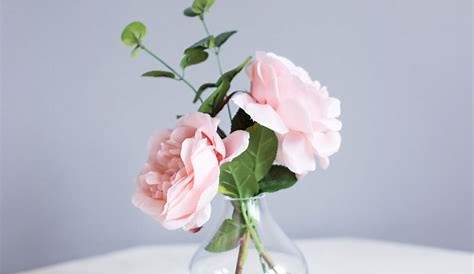 Simple arrangements in bud vases using the same flowers as the