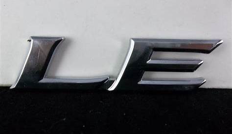 2007-2017 Toyota Camry "LE" Rear Plastic Trunk Trim Level Emblem OEM