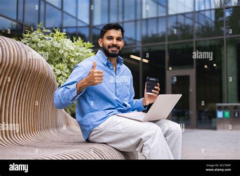 Male student with laptop hispanic park hi-res stock photography and ...