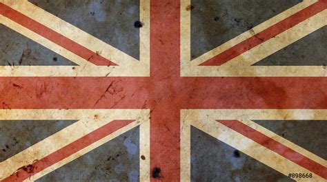 Old vintage UK British flag over white wood - stock photo | Crushpixel