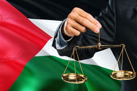 Palestinian Judge Is Holding Golden Scales Of Justice With Palestine