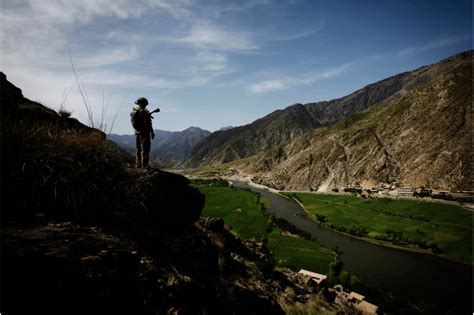 An American Soldier Looking Over The Pech Valley In Kunar Province In