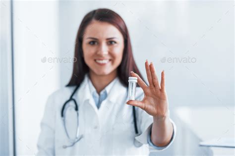 Holding Drugs In Hand Young Nurse Indoors In Modern Clinic Conception
