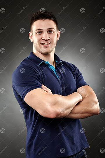 Handsome Young Man With Arms Folded Stock Photo Image Of Friendly