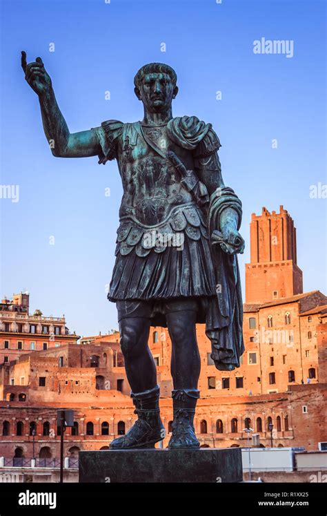Bronze Statue Of Julius Caesar In The Fori Imperiali Road At Sunset