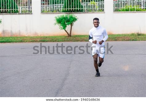 Young Black Man Jogging On Road Stock Photo 1960168636 Shutterstock