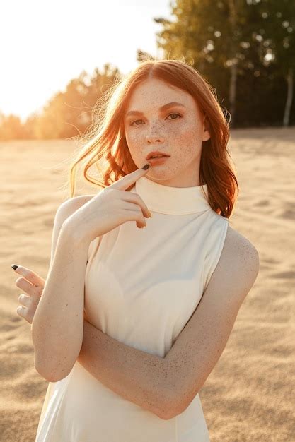 Premium Photo Portrait Of Calm Young Ginger Woman With Freckles