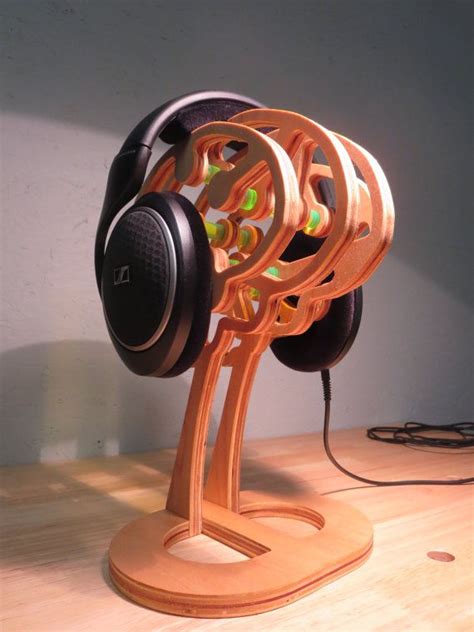 Super creative diy headphone stands (some are from recycled materials). The Thinker Headphone Stand by DesignByWood on Etsy, $130.00 | Diy headphone stand